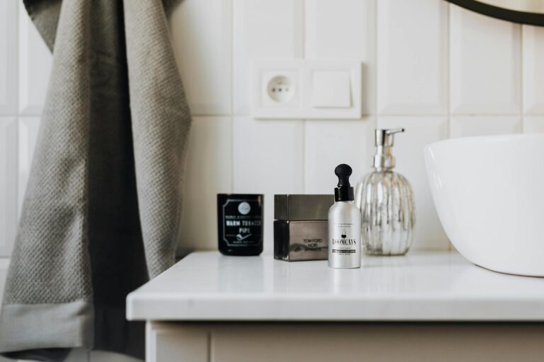 Sophisticated bathroom countertop with toiletries and modern decor for daily skincare routine.